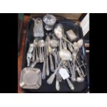 A collection of flatware, table lighter