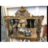 A decorative gilt framed wall mirror - 76cm x 76cm