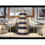 A wooden lighthouse table lamp, seagulls