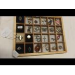 A tray of silver jewellery including rings and pen