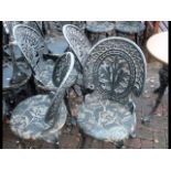 A set of four decorative cast metal pub/garden cha