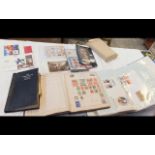 A box of stamps and First Day Covers