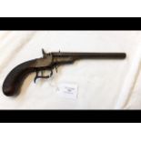 An antique long barrel pistol with wooden grip, ha