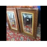 A pair of decorative oak framed wall mirrors