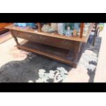 A rustic oak coffee table with drawers