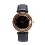 A GENTLEMANS VINTAGE WITTNAUER AUTOMATIC WRIST WATCH the gold plated case enclosing a black dial