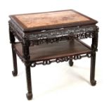 A 19TH CENTURY CARVED CHINESE HARDWOOD CONSOL / ALTAR TABLE with inset marble top surrounded by a