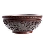 AN EARLY 20TH CENTURY CARVED CIRCULAR BOWL with leaf work decoration and dated 1907 30cm diameter