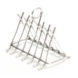 A SILVER PLATED NOVALTIY GOLF CLUB TOASTRACK with crossed over drivers - numbered 2819 14cm wide