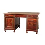 A LATE 19TH CENTURY FLAMED MAHOGANY FRENCH PARTNERS DESK the green leather top with gilt Greek key