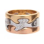 AN 18CT GOLD INTERLOCKING RING BY GEORGE JENSON having White, Rose and Yellow gold bands set with