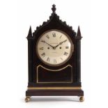 W STRANGE. LONDON A LATE REGENCY FIGURED MAHOGANY BRACKET CLOCK the gothic style case with brass