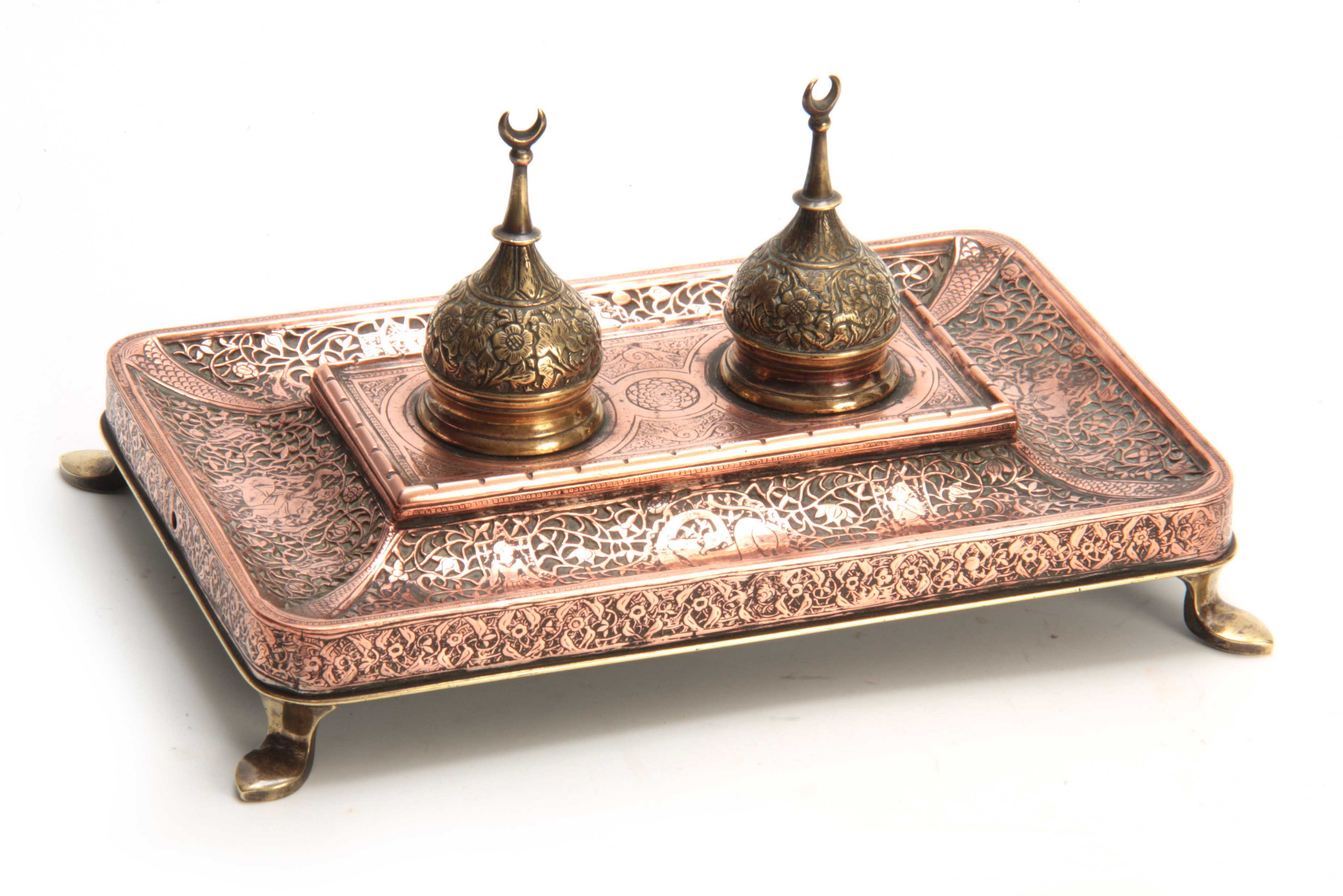 A 19TH CENTURY COPPER AND BRASS PERSIAN STYLE INK STAND with dome-shaped lids and Turkish moons