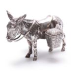 AN UNUSUAL LATE 19TH CENTURY CONTINENTAL SILVER CRUET SET realistically modelled as a saddled donkey