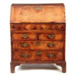 AN EARLY 18TH CENTURY QUEEN ANNE WALNUT BUREAU HAVING SUPERB ORIGINAL COLOUR AND PATINA the hinged