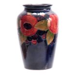 AN EARLY 20th CENTURY WILLIAM MOORCROFT VASE with pomegranate design, signed and impressed marks