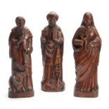 THREE 18TH CENTURY STYLE CARVED RELIGIOUS FIGURES 34cm high and smaller.