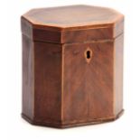 A GEORGE III FLAMED MAHOGANY OCTAGONAL SHAPED TEA CADDY with cross-banded and boxwood edges,