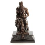 A LARGE 19TH CENTURY BRONZE SCULPTURE OF MOSES seated on a shaped black marble plinth base 54cm