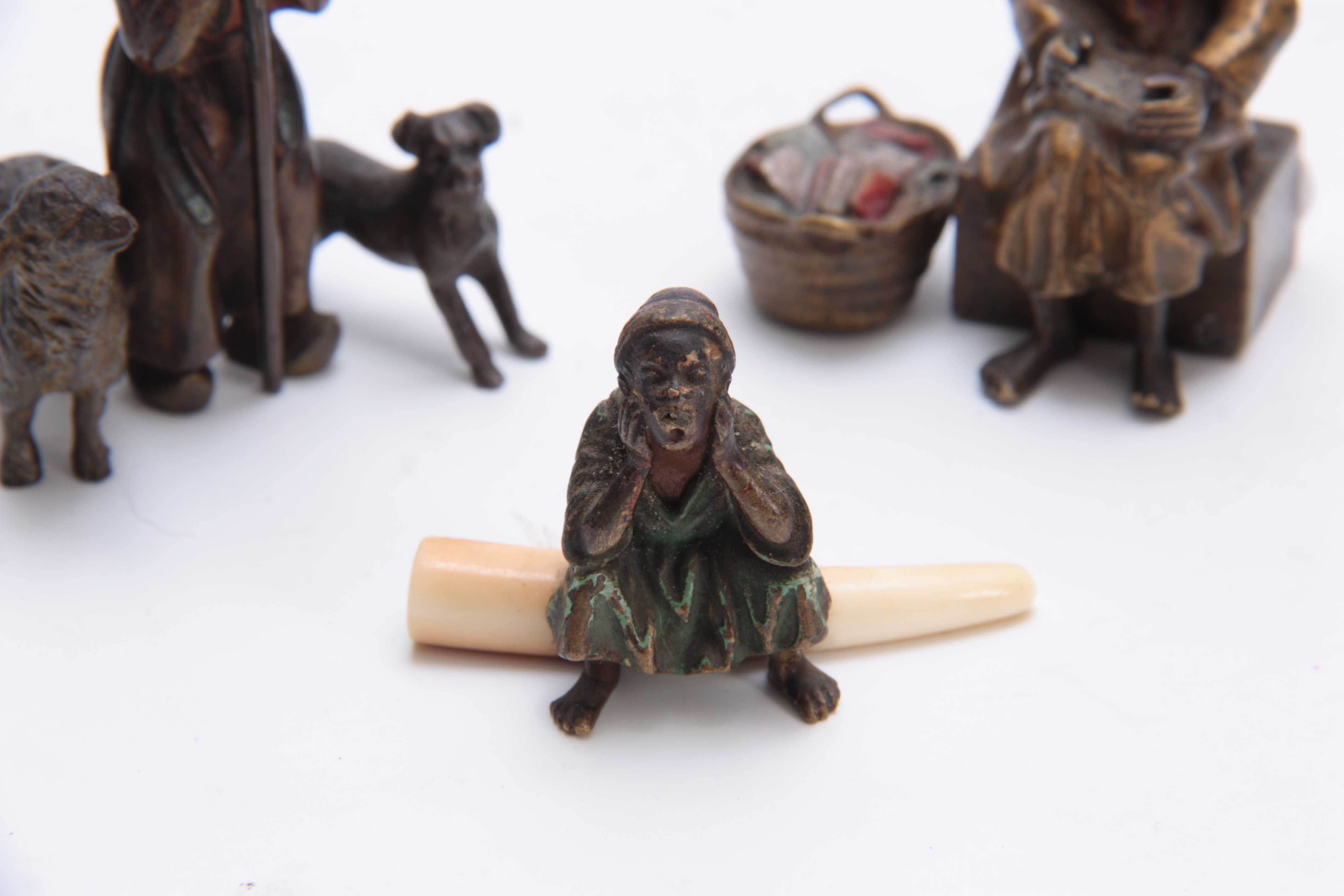 A COLLECTION OF THREE EARLY 20th CENTURY COLD PAINTED BRONZE FIGURES modelled as an Arab bookseller, - Image 4 of 5