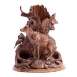 A LATE 19TH CENTURY SWISS BLACK FOREST CARVED LINDENWOOD ONE PIECE VASE depicting a mountain goat