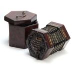 A LATE 19th CENTURY CONCERTINA POSSIBLY BY WHEATSTONE having pierced rosewood ends inlaid with