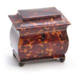 AN EARLY 19TH CENTURY TORTOISESHELL PAGODA SHAPED TEA CADDY having ivory and silver wire inlays, the