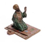 FRANZ BERGMAN AN EARLY 20th CENTURY AUSTRIAN COLD PAINTED BRONZE modelled as a praying Arab knelt on