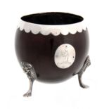 A GEORGE III SILVER MOUNTED COCONUT SHELL CUP POSSIBLY IRISH with oval coat of arms and lions head