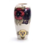 A MOORCROFT TAPERING SHOULDERED VASE decorated with leafing different coloured pansy sprays on a