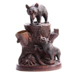 A LATE 19TH CENTURY SWISS CARVED BEAR TOBACCO BOX with hinged compartment and brass match holder