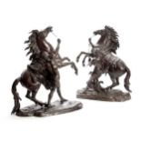 A LARGE PAIR OF LATE 19th CENTURY FRENCH PATINATED BRONZE SCULPTURES modelled as Marley Horses on