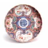 A 19TH CENTURY IMARI SCALLOP EDGED DISH colourfully decorated with birds and floral decoration,