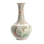 A CHINESE REPUBLIC FAMILLE ROSE VASE decorated with flowers and blossoming trees with a pale blue