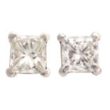 A PAIR OF WHITE GOLD SQUARE CLAW SET DIAMOND SOLITAIRE EAR STUDS