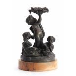 A 19TH CENTURY FRENCH BRONZE SCULPTURE modelled as cupids amidst fruiting vines - on a Sienna marble