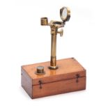 A LATE 19th CENTURY PORTABLE MICROSCOPE having a hinged mahogany box with brass threaded fitting