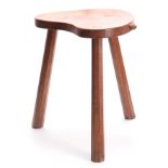 A ROBERT MOUSEMAN THOMPSON ADZED OAK COW STOOL OF GENEROUS SIZE the dished heart-shaped top with