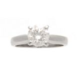 A HALLMARKED WHITE GOLD SOLITAIRE BRILLANT CUT DIAMOND RING with square four claw open setting