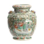 A CHINESE FAMILLE VERT VASE with raised masks and floral borders surrounding panels depicting