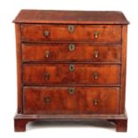 A WILLIAM AND MARY YEW-WOOD CHEST OF DRAWERS having a D shaped moulded edge top above four graduated