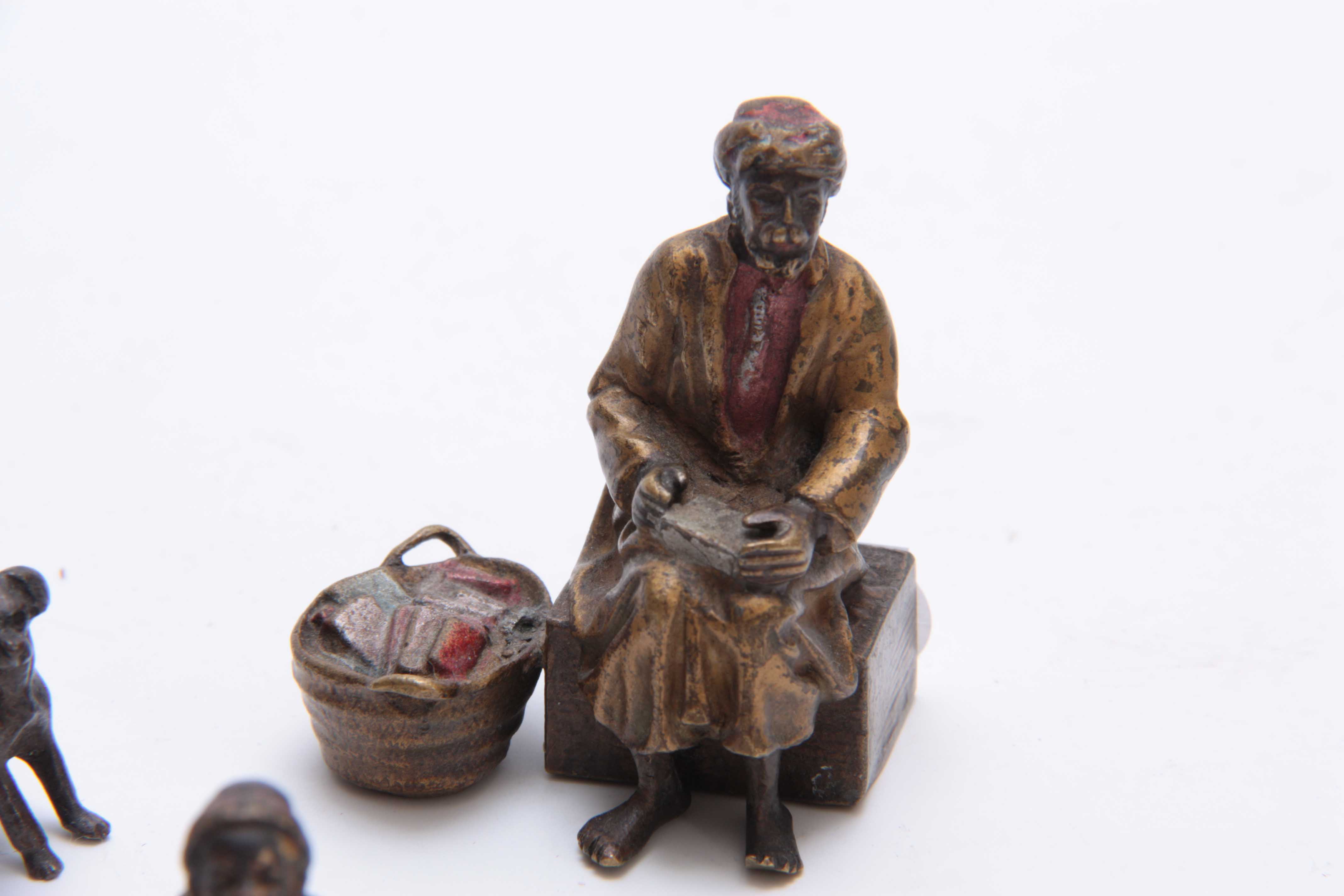 A COLLECTION OF THREE EARLY 20th CENTURY COLD PAINTED BRONZE FIGURES modelled as an Arab bookseller, - Image 2 of 5