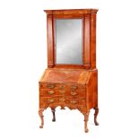 AN UNUSUAL QUEEN ANNE FIGURED WALNUT BUREAU BOOKCASE top mirrored door flanked by tapering reeded
