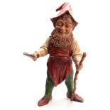 A LARGE EARLY 20TH CENTURY EASTERN EUROPEAN POLYCHROME PAINTED TERRACOTTA STANDING GNOME holding a