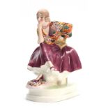 A GOLDSCHEIDER AUSTRIAN DECO FIGURE depicting a stylish seated young lady in colourful costume; on a