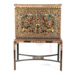 AN UNUSUAL DECORATIVE INDIAN CABINET ON STAND with coloured cut glass pieces depicting figures