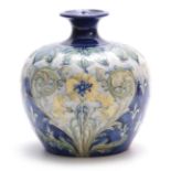 AN UNUSUAL MACINTYRE AND CO LARGE BULBOUS FLORIAN WARE VASE DESIGNED BY WILLIAM MOORCROFT