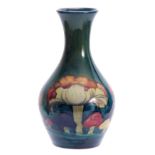 A MOORCROFT CLAREMONT BALUSTER VASE the body decorated with a continuous band of unusual