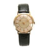 A VINTAGE LE-COULTRE MYSTERY WRIST WATCH on crocodile leather strap, the 10ct gold filled case