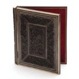 A LATE 19th CENTURY ANGLO-INDIAN CARVED EBONY AND IVORY PRESS shaped in the form of a book with